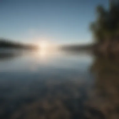 Calm water surface reflecting a clear sky