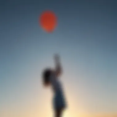 A person releasing a balloon into the sky