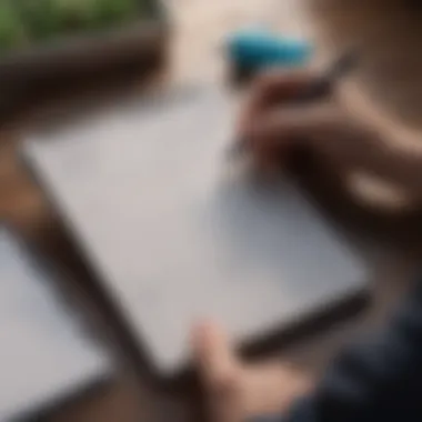 A person setting achievable goals on a notepad