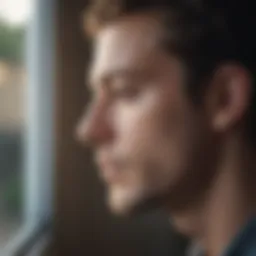 A close-up view of a person looking thoughtfully out of a window, reflecting on their thoughts.